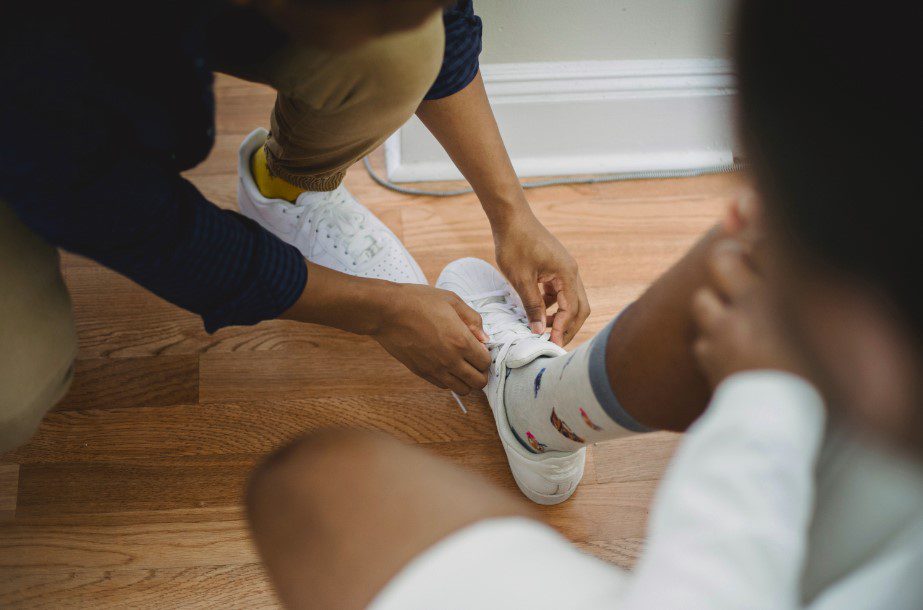 Photo by Ketut Subiyanto: https://www.pexels.com/photo/close-up-of-man-helping-partner-tie-shoes-4827135/