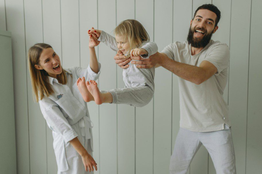 baby tossing inside the house